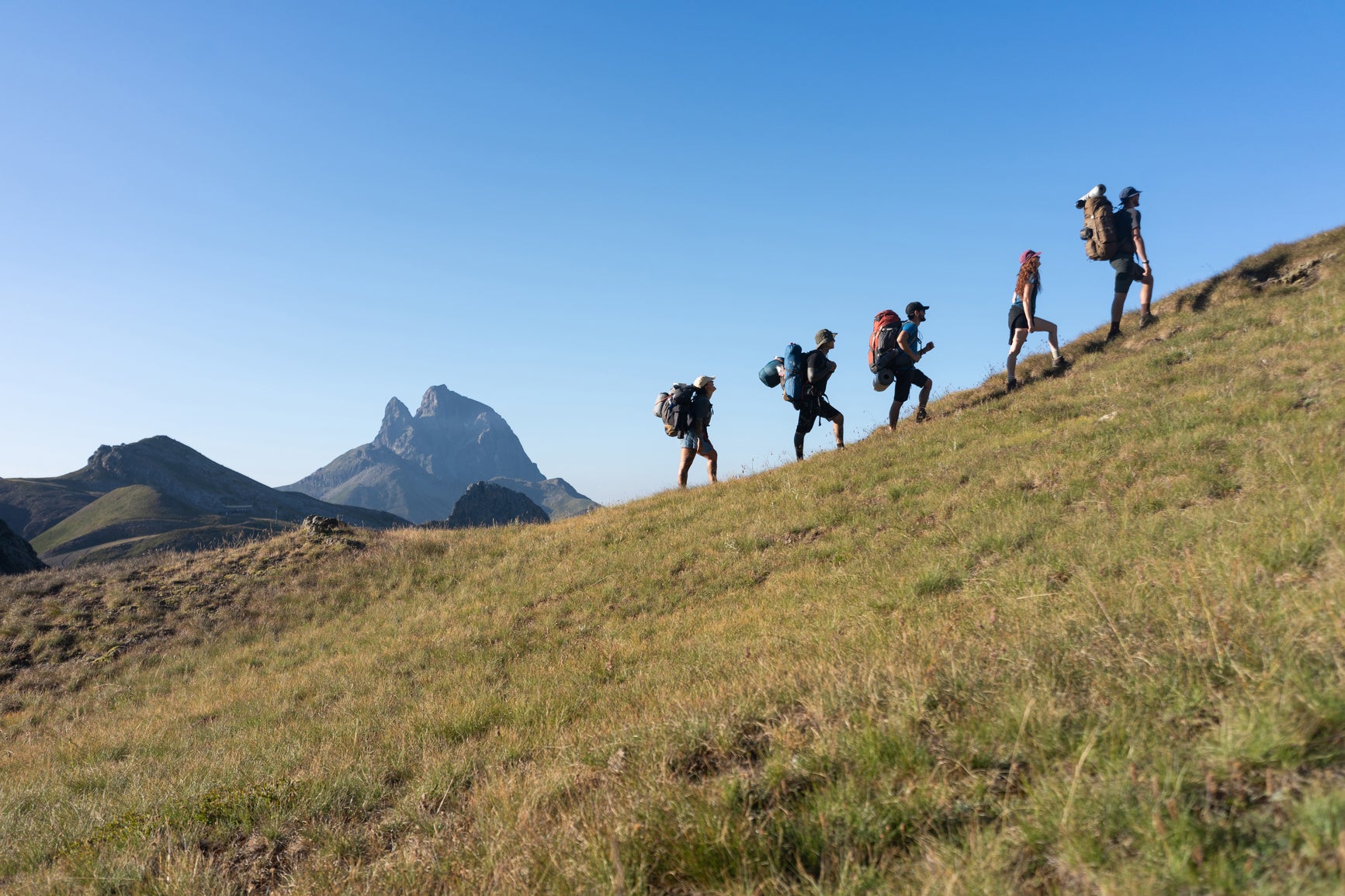 people hiking in the mountains